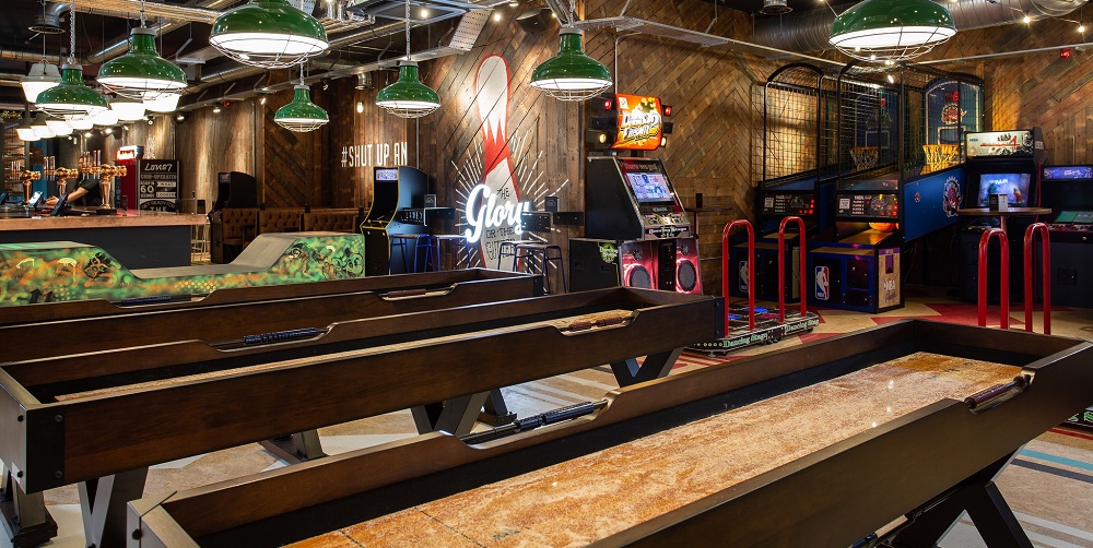 Inside Lane7 in Birmingham, showing their shuffleboard tables. Similar ones are available at Lane7 Bristol, perfect for a night of shuffleboard in Bristol