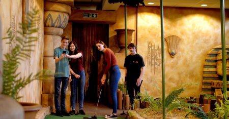 Students playing crazy golf at Paradise Island in Glasgow