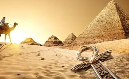 A picture of a pyramid and camel in the desert. Relating to the pharaoh themed room at Exitus in Cardiff