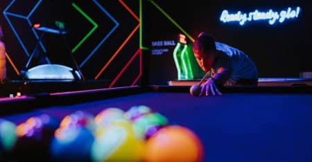 Playing pool inside the neon glowing, PlayBox