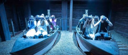 Guests in a boat with VR headsets on at War of the Worlds