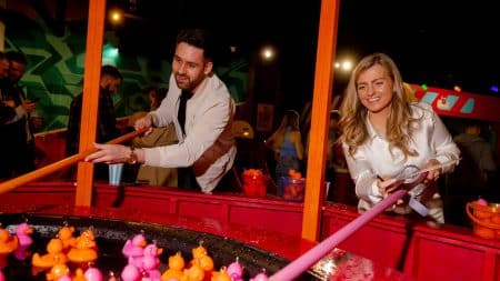 People playing hook a duck at Fayre Play in Edinburgh